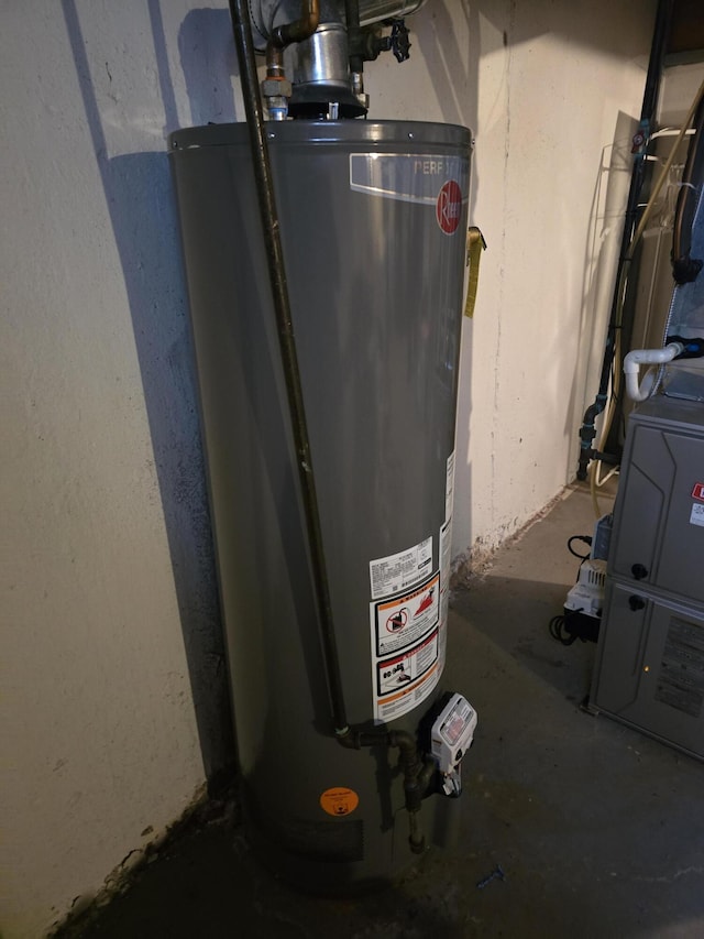 utility room featuring water heater