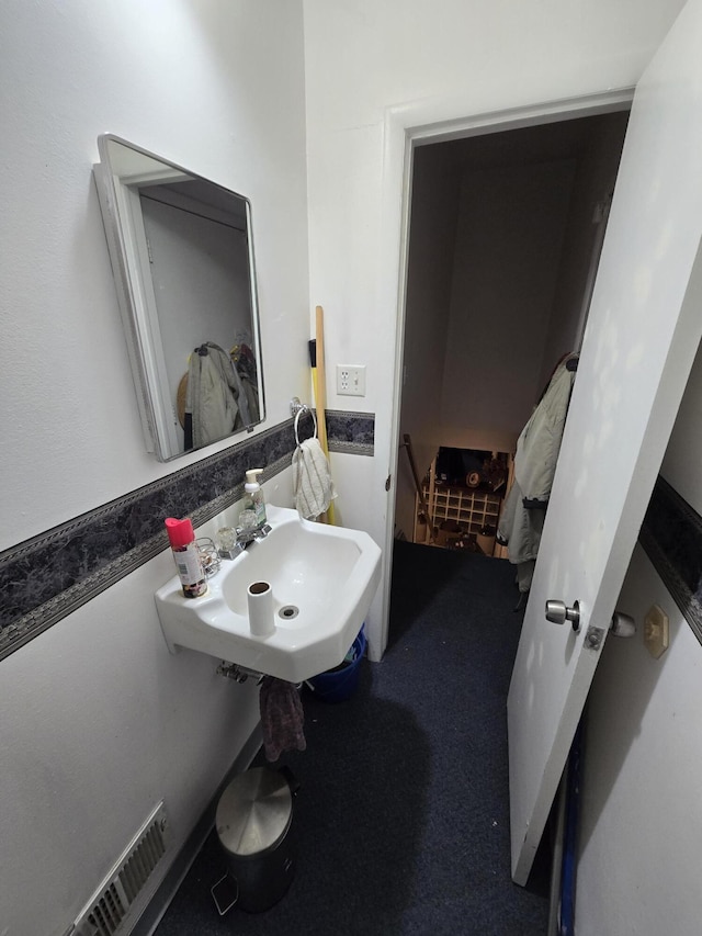 bathroom with a sink and visible vents