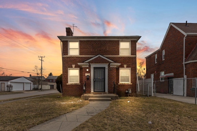 traditional home featuring a front lawn, brick siding, a chimney, and fence