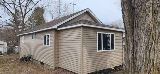 view of side of property with fence