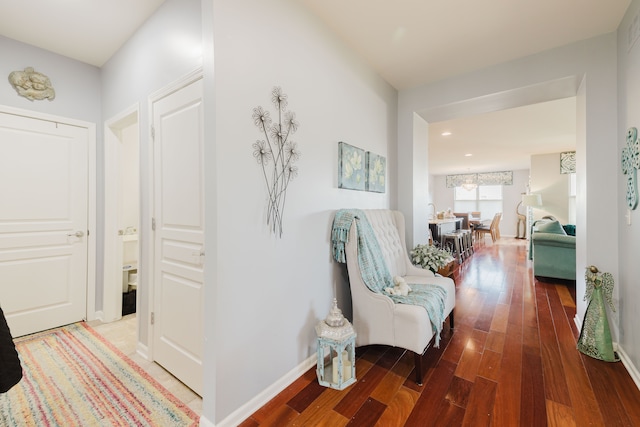 hallway with recessed lighting, baseboards, and wood finished floors