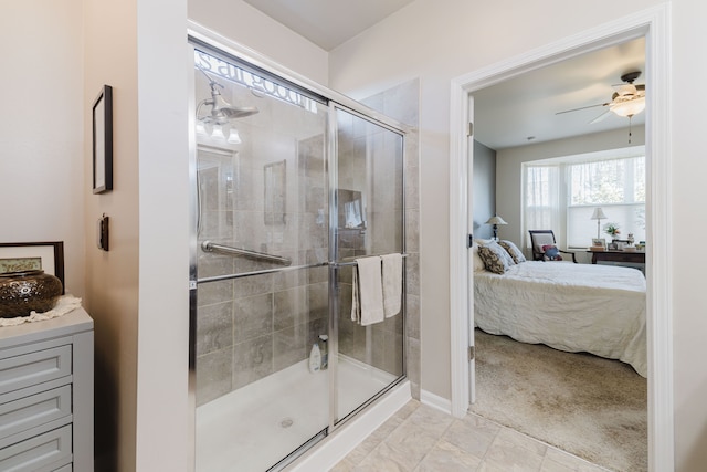 bathroom with vanity, a ceiling fan, a stall shower, and ensuite bathroom