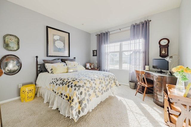 bedroom featuring baseboards and carpet