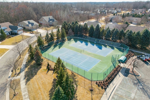 birds eye view of property featuring a view of trees