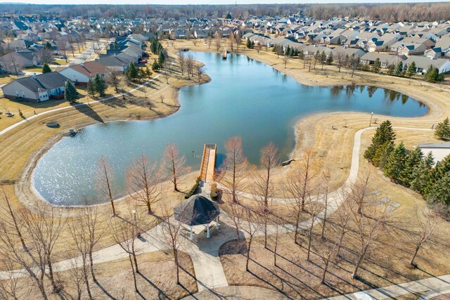 aerial view featuring a residential view and a water view