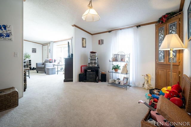 game room featuring ornamental molding, carpet, a healthy amount of sunlight, and a textured ceiling