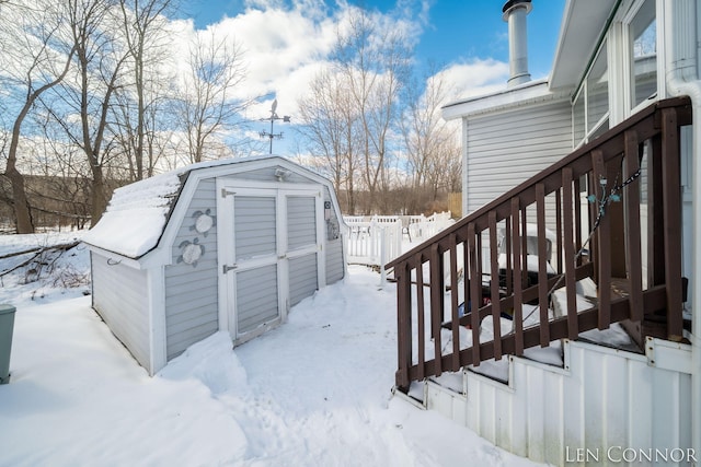 exterior space featuring stairs, an outdoor structure, and a storage unit