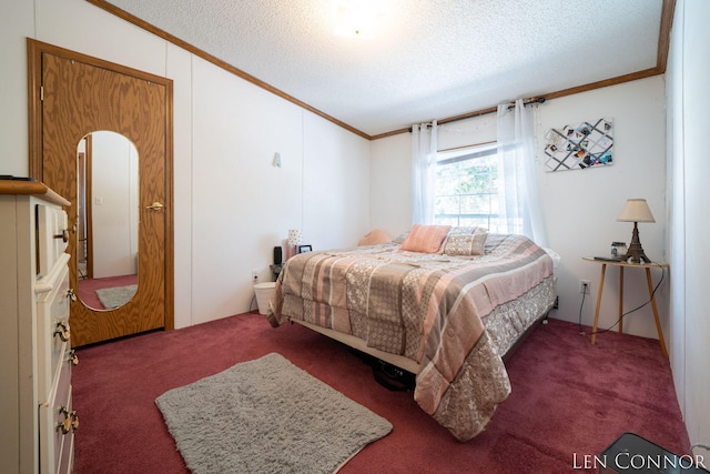 bedroom with carpet floors, a textured ceiling, and crown molding