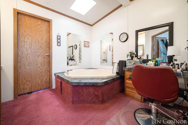 full bath featuring ornamental molding, vaulted ceiling with skylight, and a garden tub