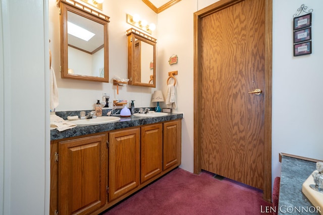 full bathroom with double vanity, ornamental molding, and a sink