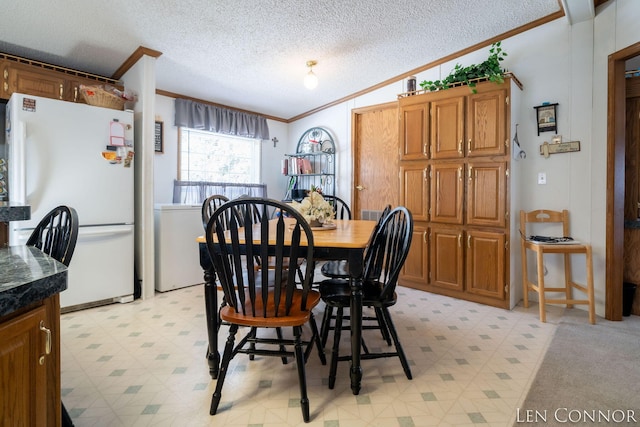 dining space with light floors, a textured ceiling, vaulted ceiling, and crown molding