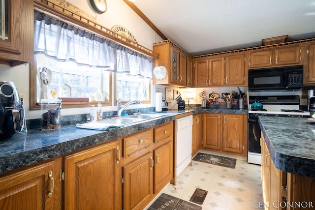 kitchen with white dishwasher, light floors, black microwave, a sink, and gas stove