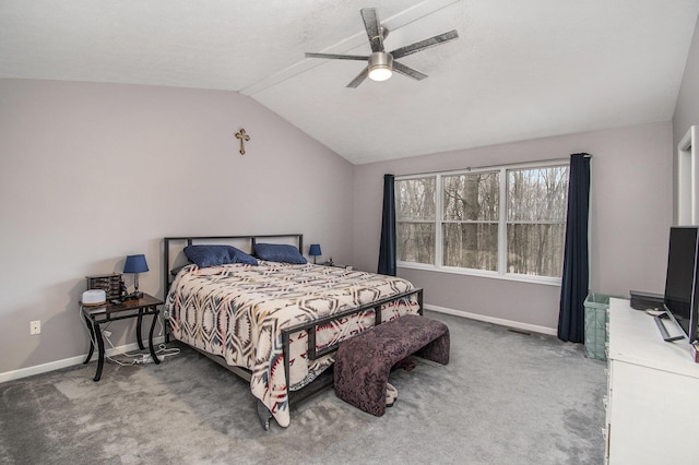 carpeted bedroom with baseboards, vaulted ceiling, and a ceiling fan