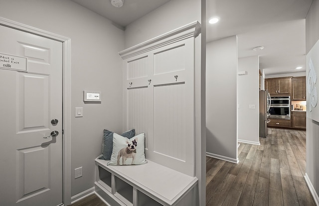 mudroom featuring recessed lighting, baseboards, and wood finished floors