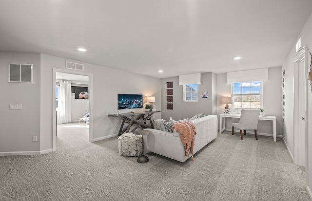 living area with visible vents, recessed lighting, baseboards, and carpet floors