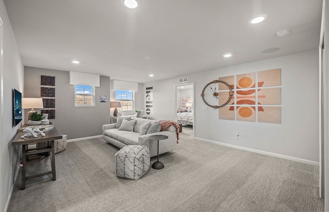 living area with visible vents, recessed lighting, baseboards, and carpet floors