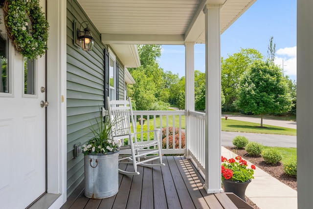 wooden terrace with a porch