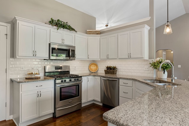 kitchen with a sink, dark wood-type flooring, white cabinets, and stainless steel appliances