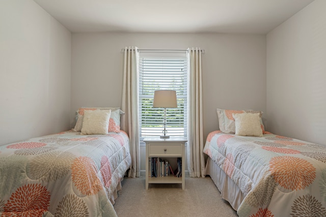 bedroom featuring light colored carpet