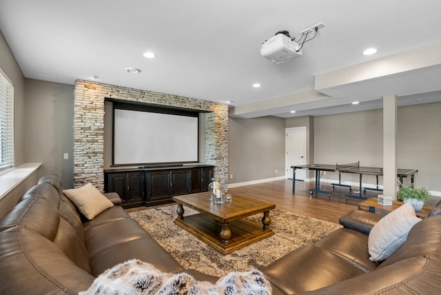 cinema room featuring recessed lighting, wood finished floors, and baseboards