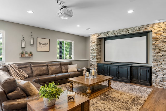 home theater featuring recessed lighting and wood finished floors