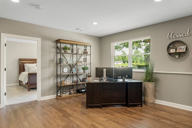 office space featuring recessed lighting, baseboards, and wood finished floors