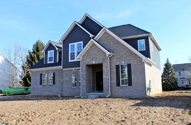 view of front of home featuring brick siding