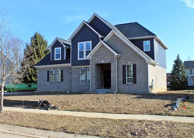 view of front of house featuring brick siding