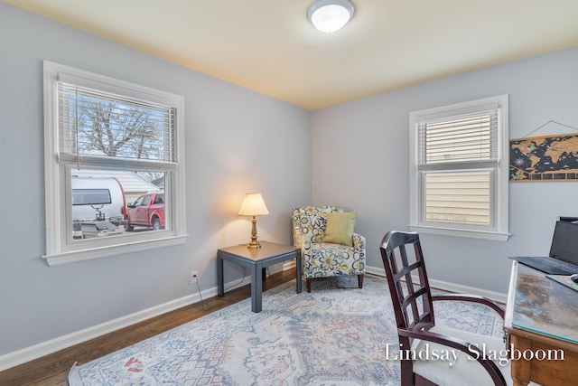 home office with wood finished floors and baseboards