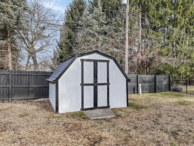 view of shed with a fenced backyard