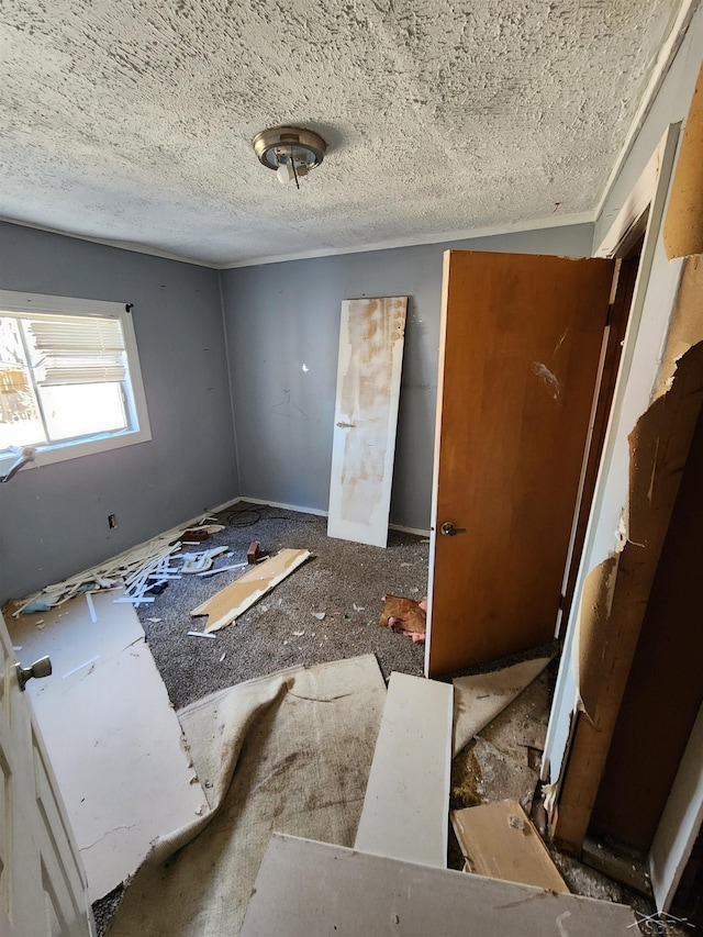 interior space featuring a textured ceiling