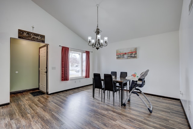 dining room with visible vents, a notable chandelier, dark wood-type flooring, high vaulted ceiling, and baseboards