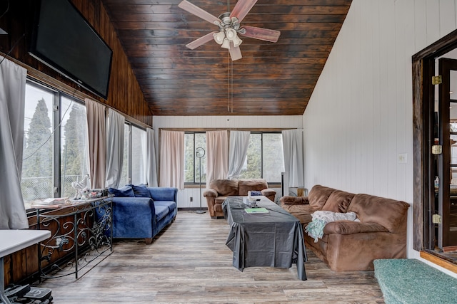 sunroom with lofted ceiling, wooden ceiling, and a ceiling fan