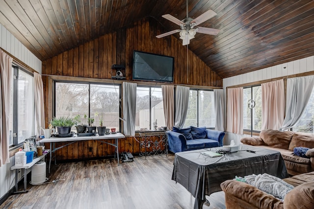 sunroom featuring lofted ceiling, wood ceiling, and ceiling fan