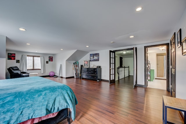 bedroom with recessed lighting, french doors, baseboards, and wood finished floors