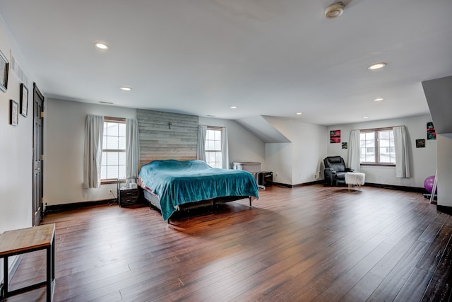 bedroom with recessed lighting, multiple windows, and wood finished floors