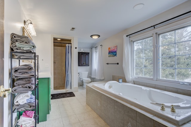 full bath featuring visible vents, tile patterned flooring, a shower stall, a garden tub, and toilet