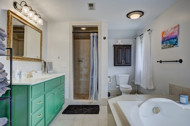 full bathroom with tile patterned flooring, tiled shower, toilet, and a bath