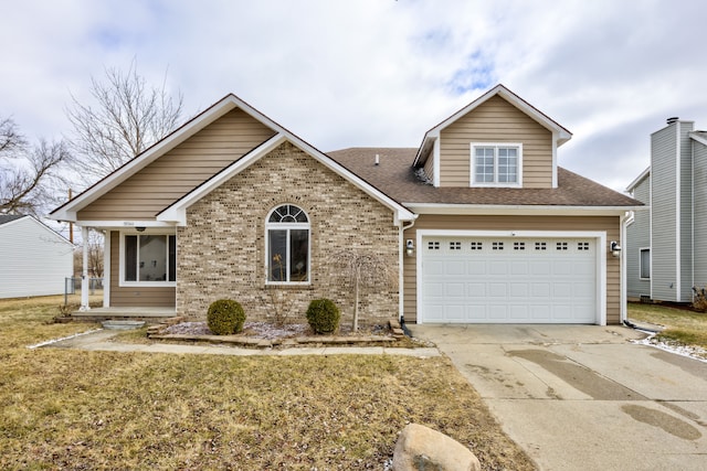 view of front of property with concrete driveway, brick siding, and roof with shingles