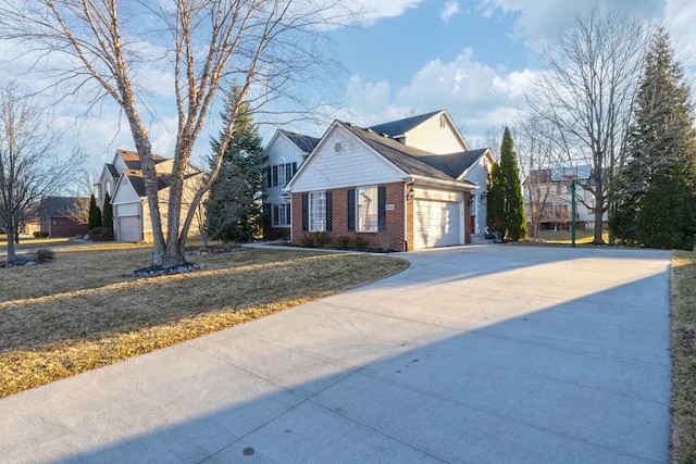 view of front of home featuring concrete driveway, a garage, brick siding, and a front yard