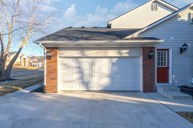 garage featuring driveway