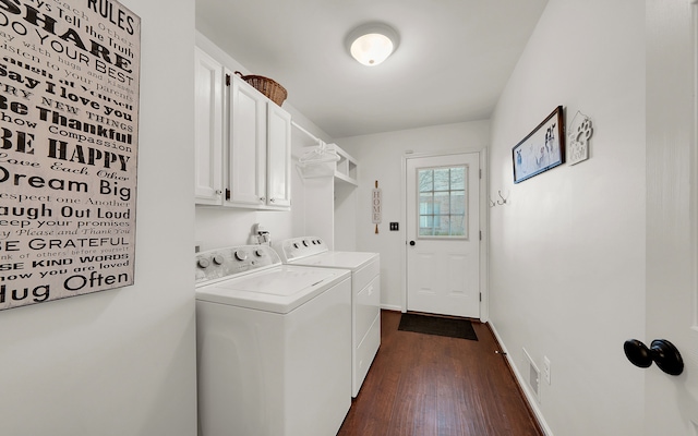 washroom featuring visible vents, dark wood-type flooring, baseboards, cabinet space, and independent washer and dryer