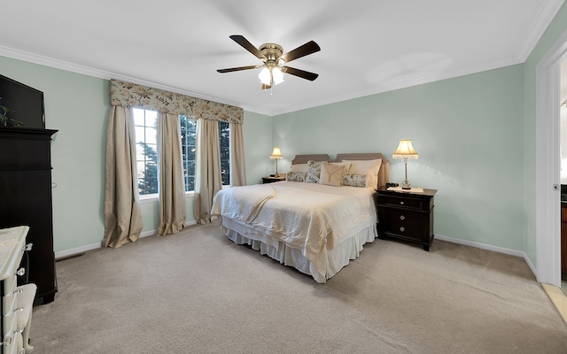 bedroom featuring light carpet, a ceiling fan, crown molding, and baseboards