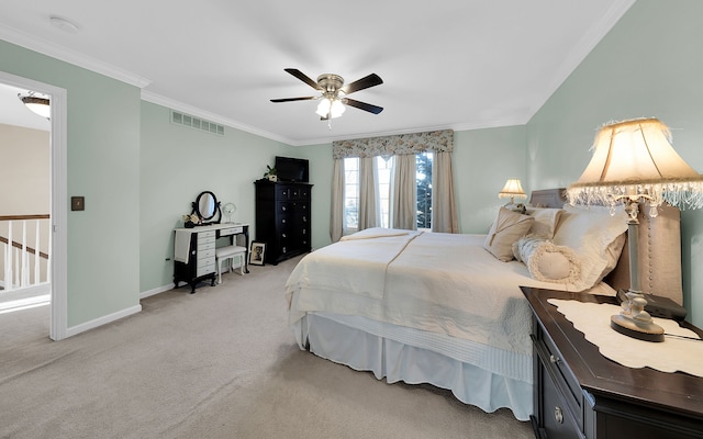 carpeted bedroom with ceiling fan, baseboards, visible vents, and ornamental molding