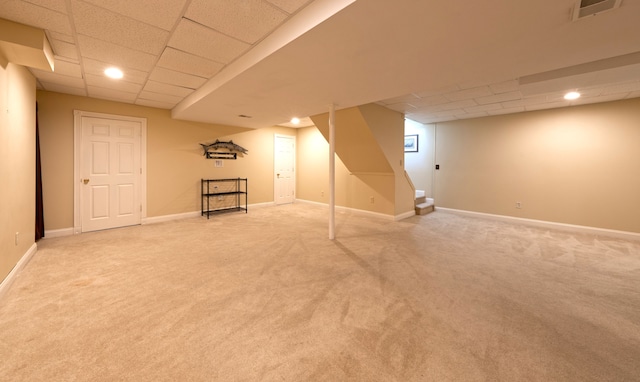 finished basement featuring visible vents, light carpet, a drop ceiling, recessed lighting, and baseboards