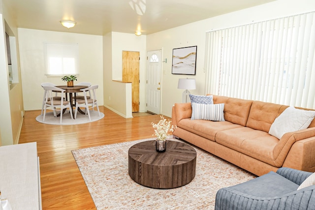 living area featuring wood finished floors and baseboards