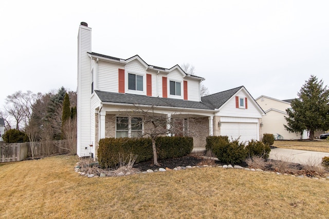 traditional-style home with brick siding, a front lawn, fence, a chimney, and a garage