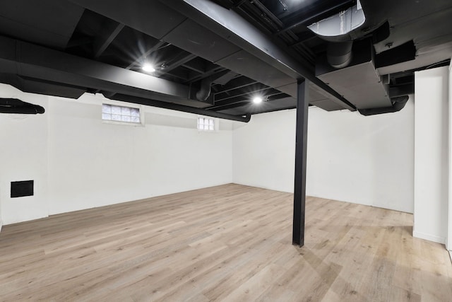 basement with wood finished floors