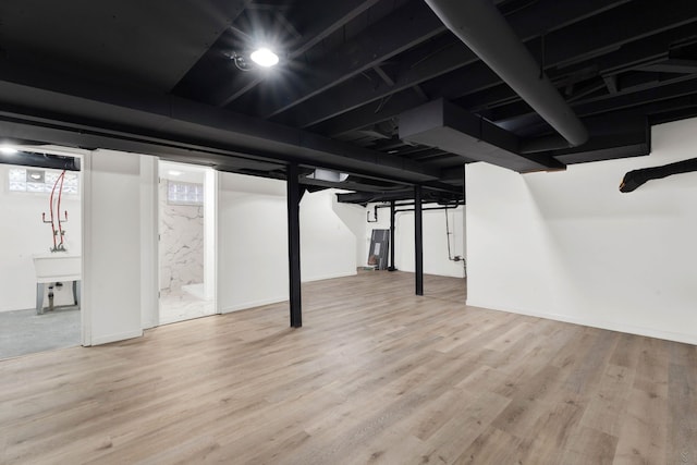 finished basement featuring wood finished floors