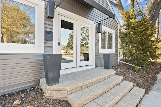view of exterior entry featuring french doors